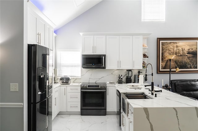 3383 Westchester Square Blvd Unit 202, Orlando, FL 32835 - kitchen featuring stainless steel appliances, a peninsula, light stone counters, white cabinetry, and high vaulted ceiling