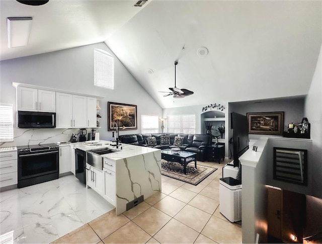 kitchen with black appliances, ceiling fan, white cabinets, and sink