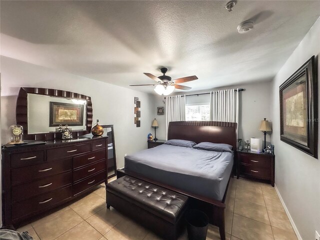 3383 Westchester Square Blvd Unit 202, Orlando, FL 32835 - bedroom with light tile patterned floors and ceiling fan