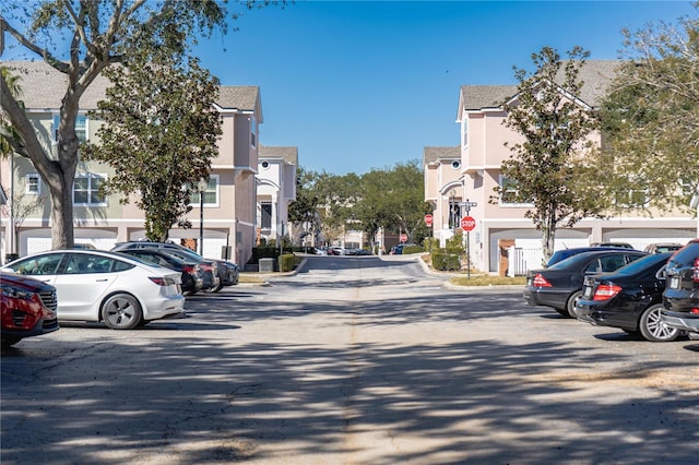 3383 Westchester Square Blvd Unit 202, Orlando, FL 32835 - view of asphalt street featuring traffic signs and a residential view