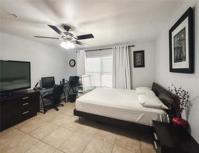 bedroom featuring light tile patterned floors and ceiling fan