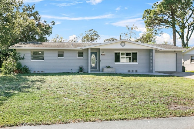 ranch-style house with a garage and a front lawn