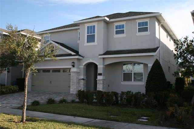 view of front of property with a garage