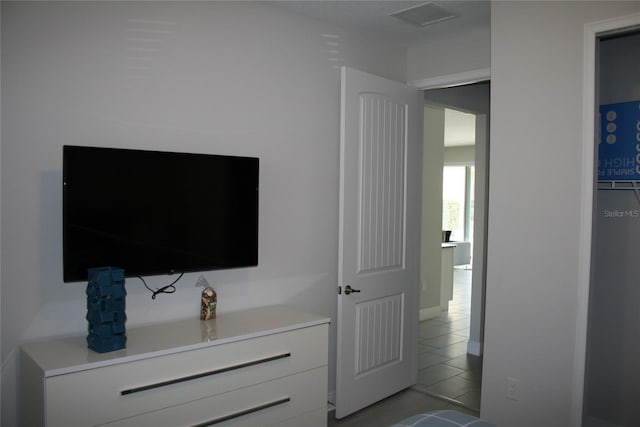 unfurnished bedroom featuring light tile patterned flooring