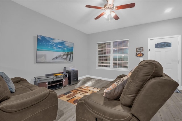 living room with wood-type flooring and ceiling fan