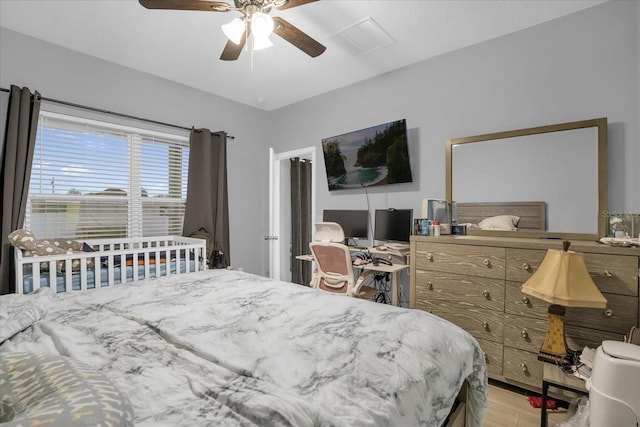 bedroom featuring ceiling fan and light hardwood / wood-style flooring