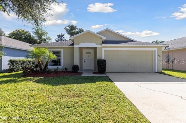 ranch-style house featuring a garage and a front yard