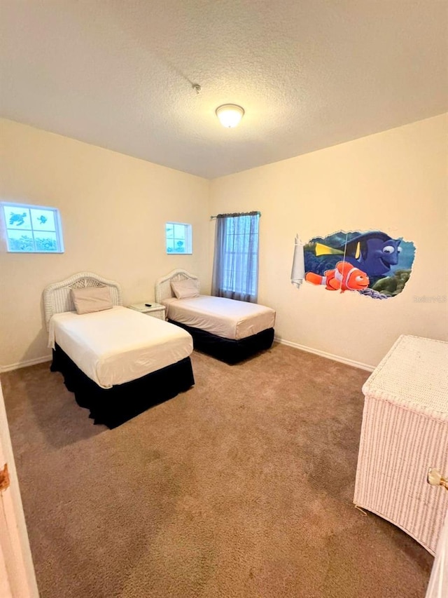 carpeted bedroom with a textured ceiling