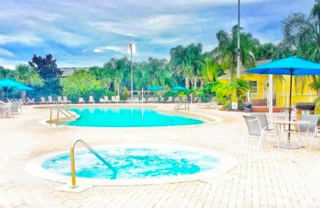 view of pool featuring a patio