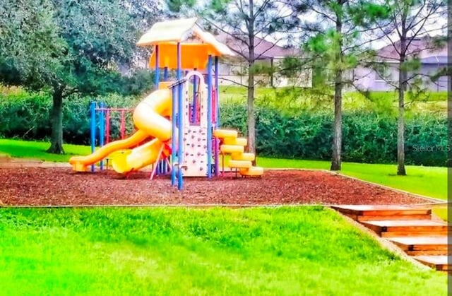 view of playground featuring a lawn