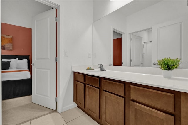 bathroom with tile patterned flooring and vanity