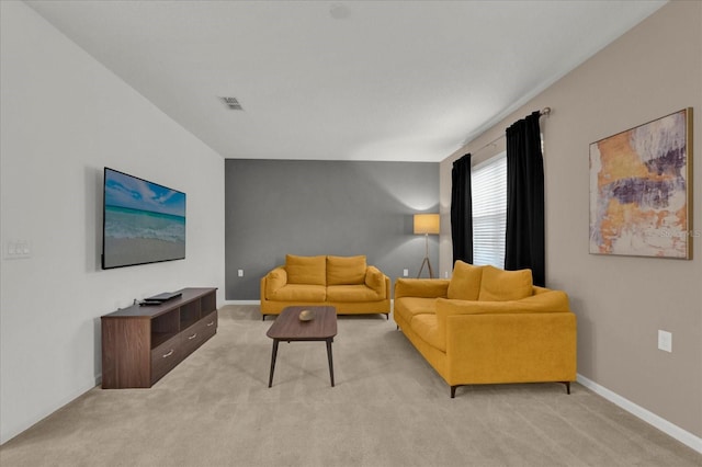 living room with visible vents, baseboards, and light colored carpet