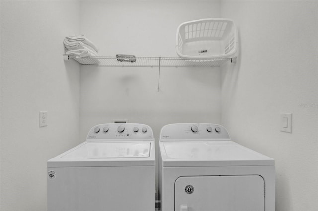 washroom with washer and dryer and laundry area