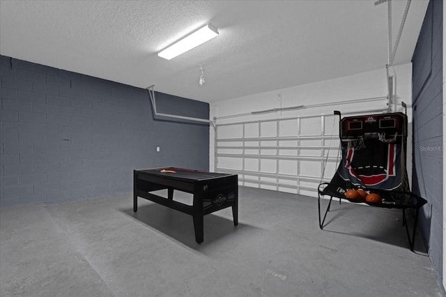 garage featuring concrete block wall