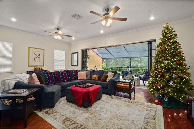 living room with ceiling fan, dark hardwood / wood-style flooring, and crown molding