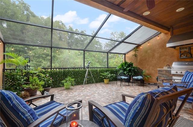 view of patio with an outdoor living space, area for grilling, a lanai, and a grill