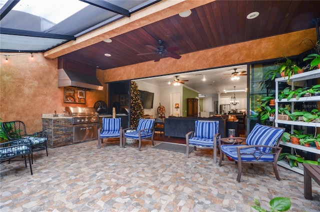 view of patio with area for grilling, grilling area, and ceiling fan