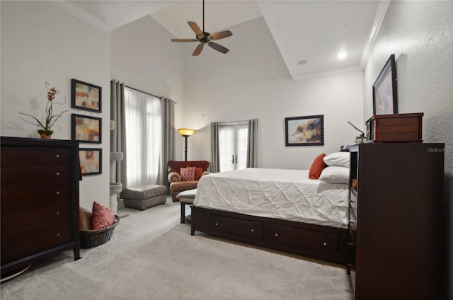 carpeted bedroom with high vaulted ceiling, ceiling fan, and ornamental molding