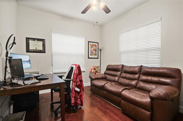 home office featuring dark hardwood / wood-style floors and ceiling fan