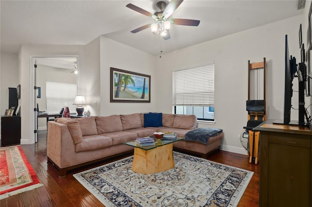 living room with ceiling fan and dark hardwood / wood-style flooring