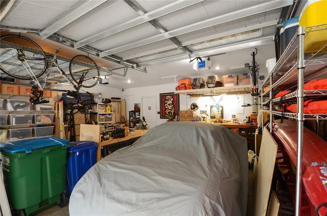 garage featuring a workshop area and a garage door opener