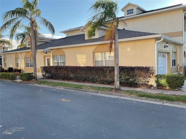 view of side of home with a garage