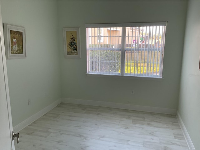 empty room with light wood-type flooring