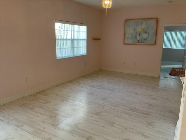 unfurnished room featuring light hardwood / wood-style floors