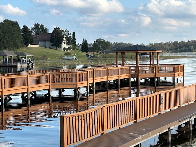 dock area featuring a gazebo and a water view