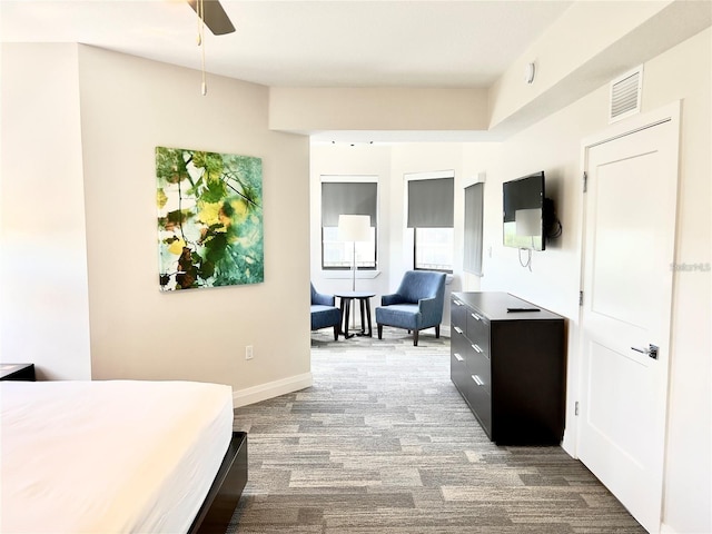 bedroom with hardwood / wood-style floors and ceiling fan