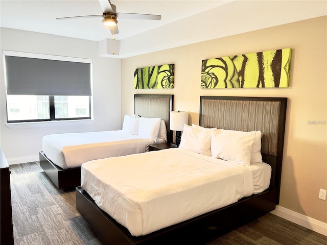 bedroom featuring ceiling fan and dark wood-type flooring