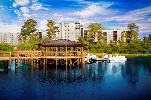 view of dock featuring a gazebo and a water view