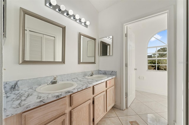 bathroom with tile patterned floors and vanity