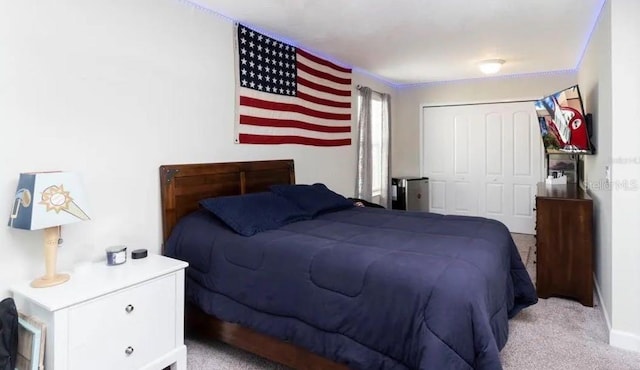 carpeted bedroom with a closet