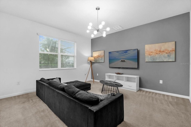 carpeted living room with an inviting chandelier