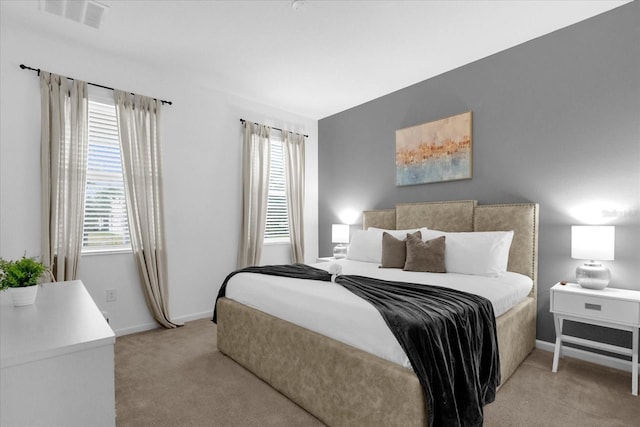 bedroom featuring light colored carpet