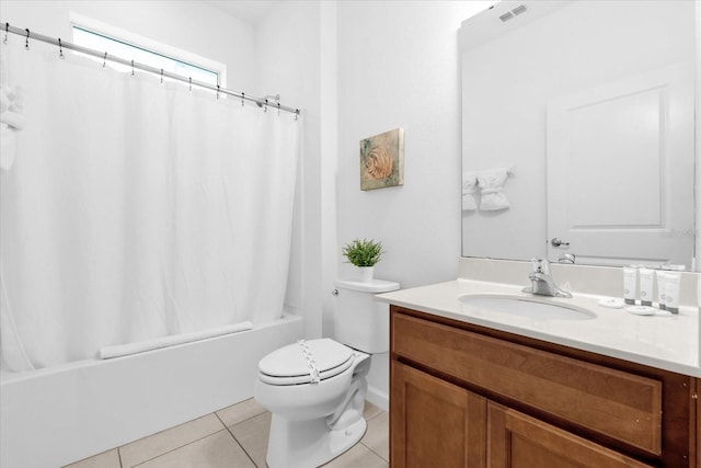 full bathroom featuring tile patterned floors, vanity, shower / tub combo, and toilet