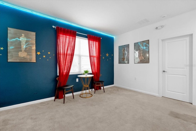 sitting room with carpet flooring