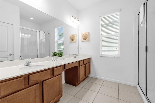 bathroom with tile patterned floors, vanity, and an enclosed shower