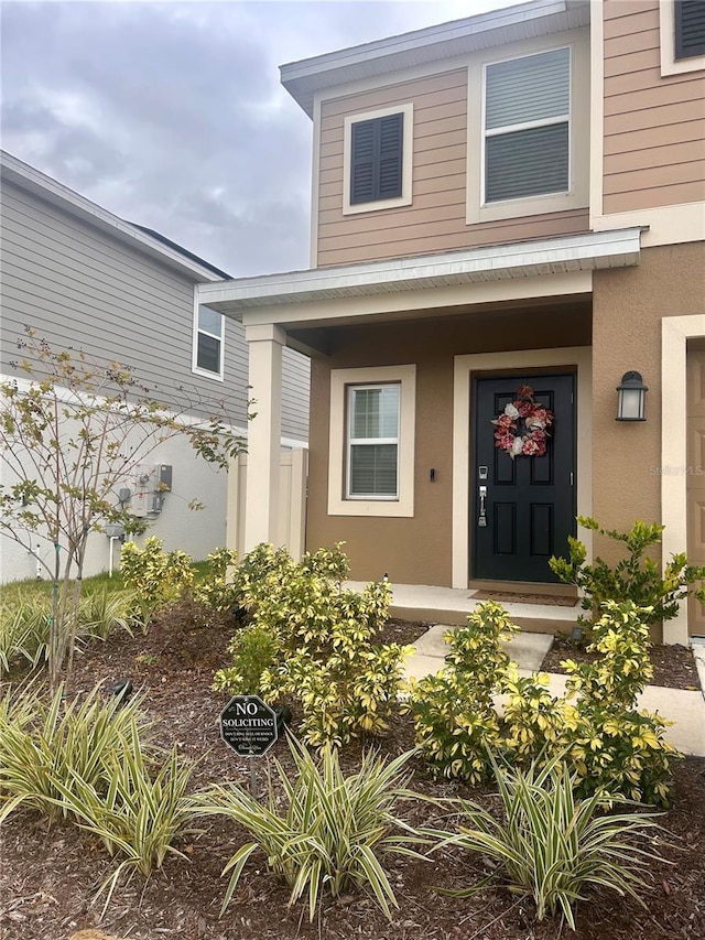 entrance to property with a porch