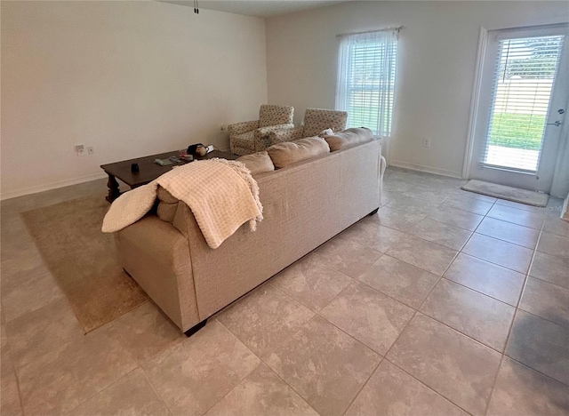 living room with light tile patterned flooring