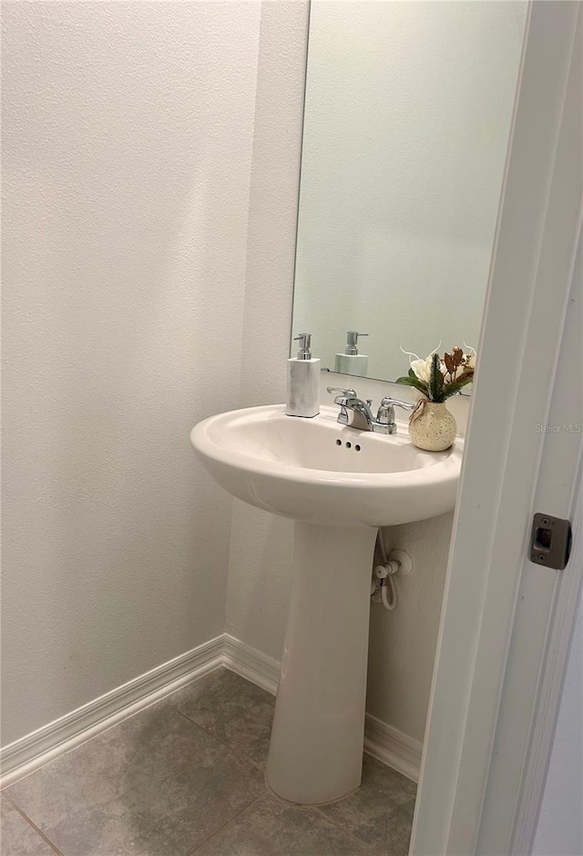 bathroom with tile patterned floors