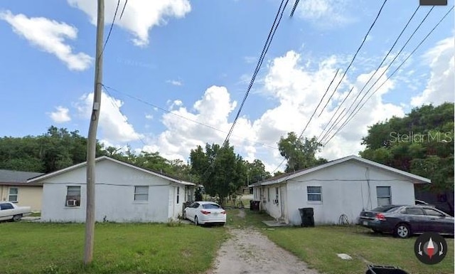 view of side of property featuring a yard