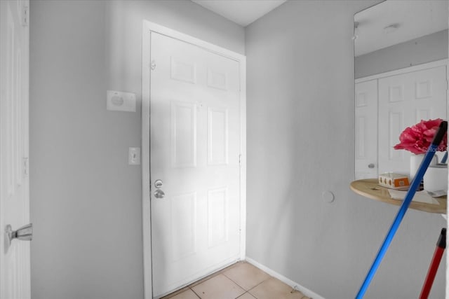 entryway featuring light tile patterned floors