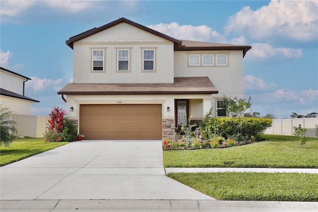 view of front of home with a garage and a front lawn