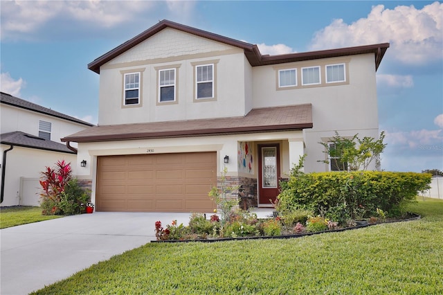 view of front of home with a garage and a front lawn