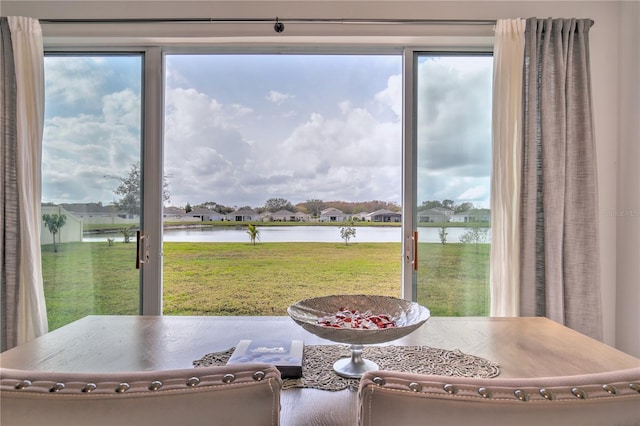 interior space with a healthy amount of sunlight and a water view