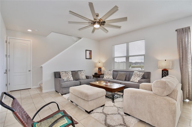 tiled living room with ceiling fan