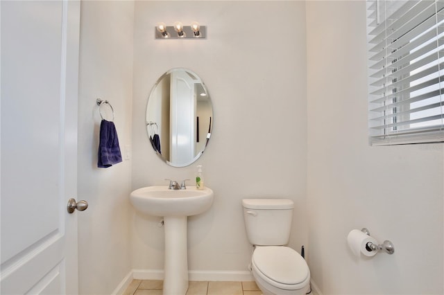 bathroom with tile patterned floors and toilet