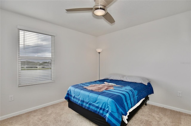 bedroom featuring ceiling fan and light colored carpet